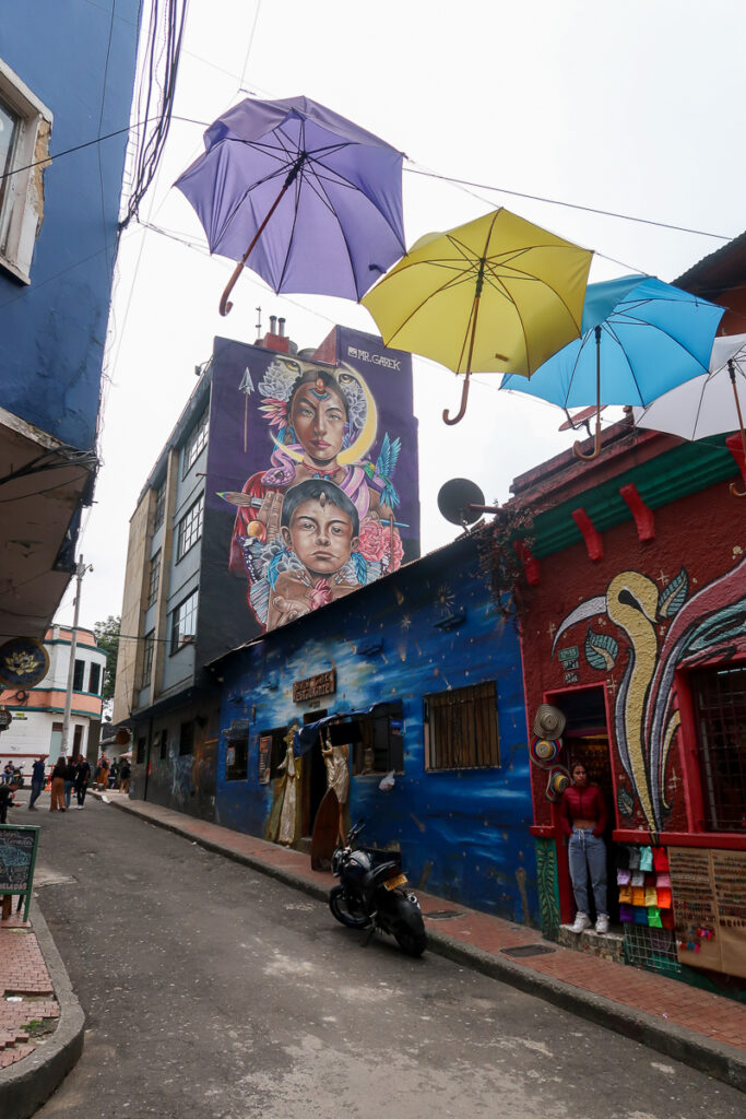 Colorful shops and tall murals in Bogota