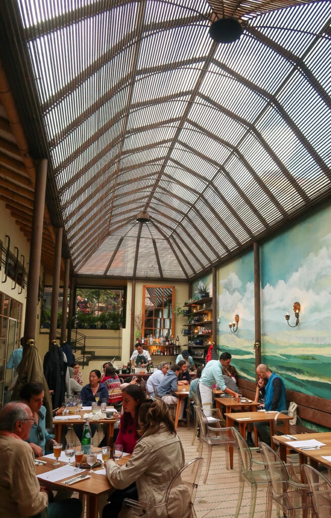 Beautiful interior of Prudencia and a crowd of people dining in