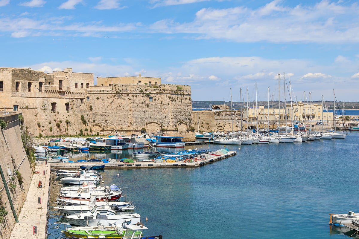 Lines of sailing boats docked by the coast of Gallipoli