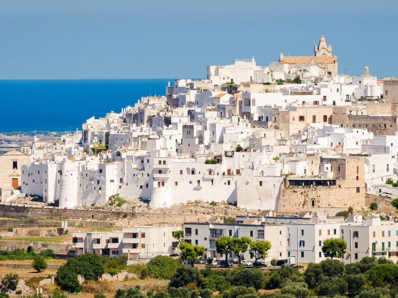 Town of Ostuni, "The White City" of Puglia. Asking why visit Puglia? These white buildings of Ostuni are definitely must-see.