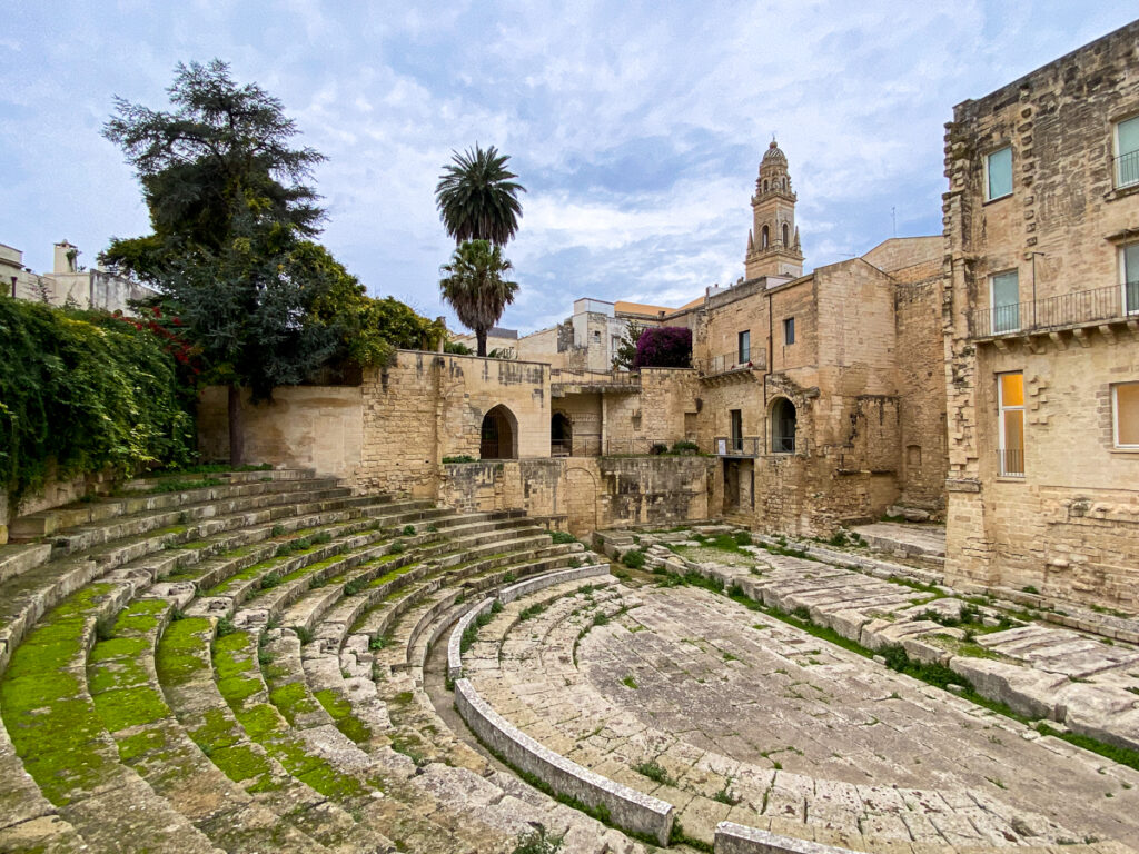 Teatro Romano with moss-covered seating. Visiting this theater is one of the best things to do in Lecce.