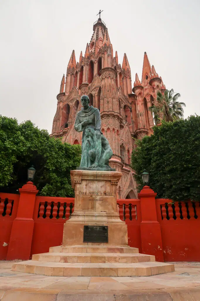 Statue of Fray Juan de San Miguel in front of the Parroquia de San Miguel Arcángel. Visiting this iconic church is one of the best things to do in San Miguel de Allende.