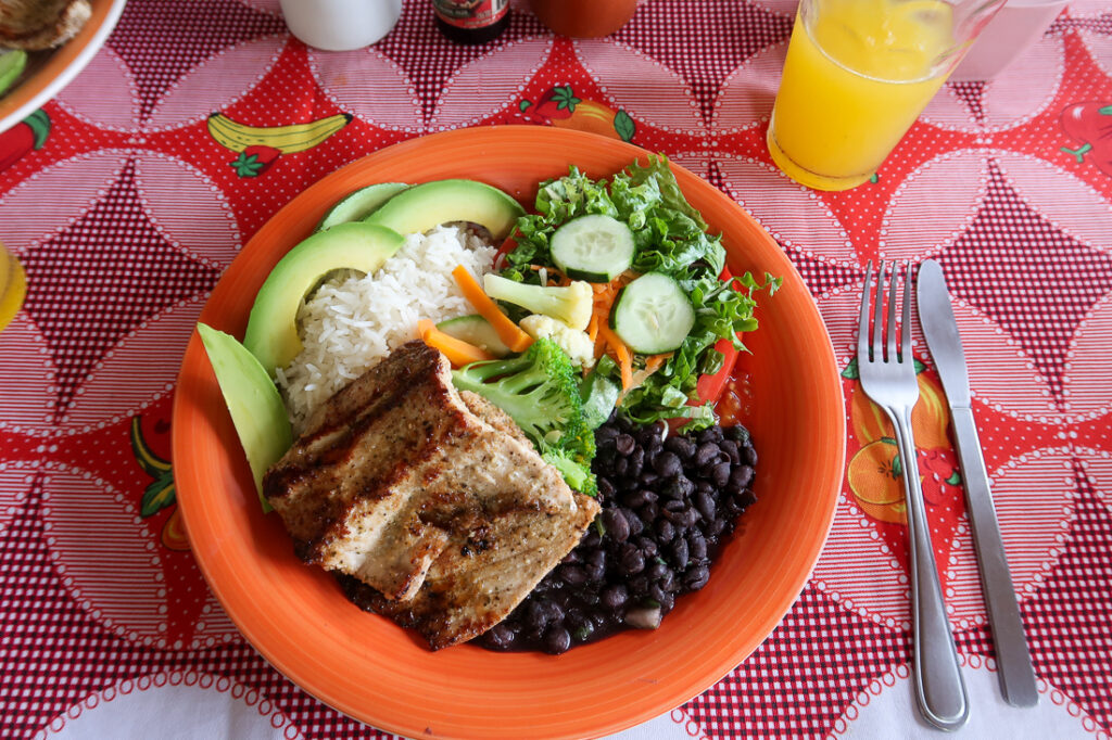 Traditional Costa Rican casado with rice and beans and fish
