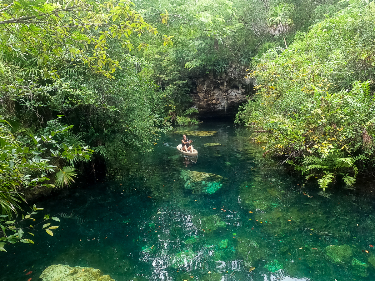 Maddy on a boat along the turquoise waters of Kantunchi Eco Park. Enjoying a water adventure is one of the best things to do in Valladolid, Mexico.