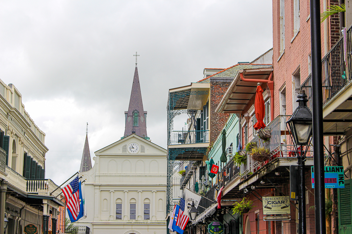A beautiful street in New Orleans and the back side of St Louis Cathedral in the background