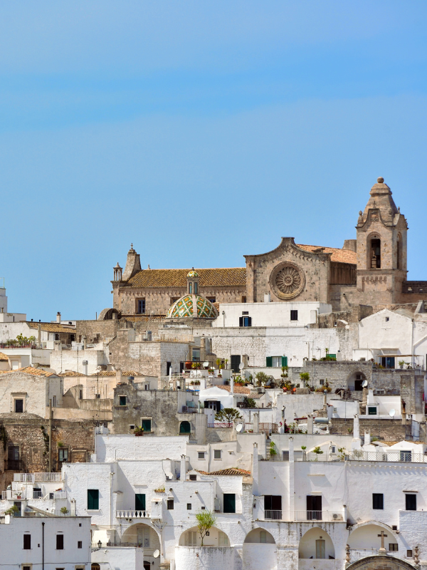 White houses of Ostuni under the clear blue sky