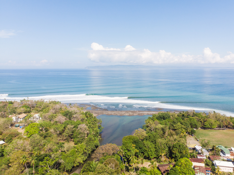 View of the vast ocean and lush trees in Pavones, Costa Rica