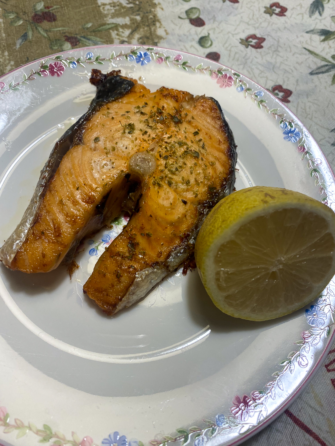 Cooked fish and lemon on a plate