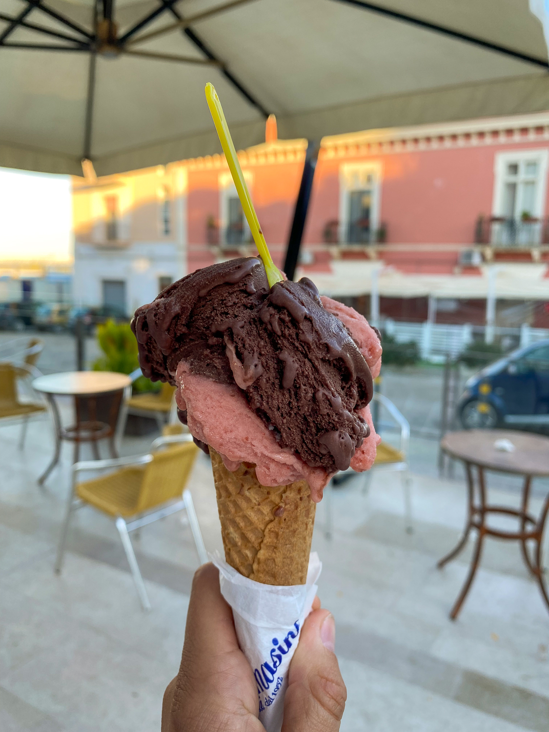 Holding a cone of ice cream