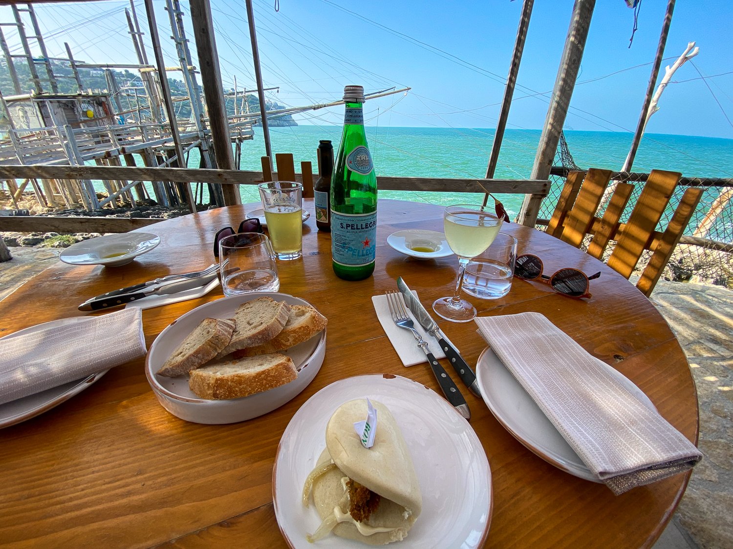 Pastries and breakfast on a table with a beautiful view of the sea in Peschici, one of the best places to visit in Puglia