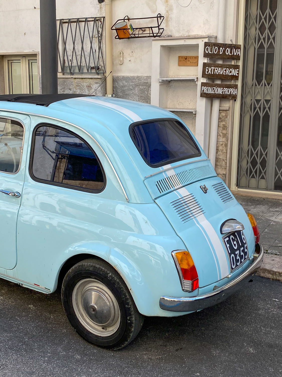 Blue car on a street in Peschici