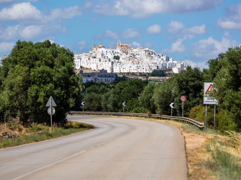 Curved road leading towards the town of Ostuni - one of the best places in Puglia