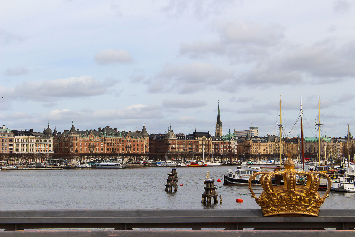 Bridge in Stockholm with a gilded crown decoration. This is one of the best viewpoints in Stockholm and a must-add to your Stockholm itinerary.