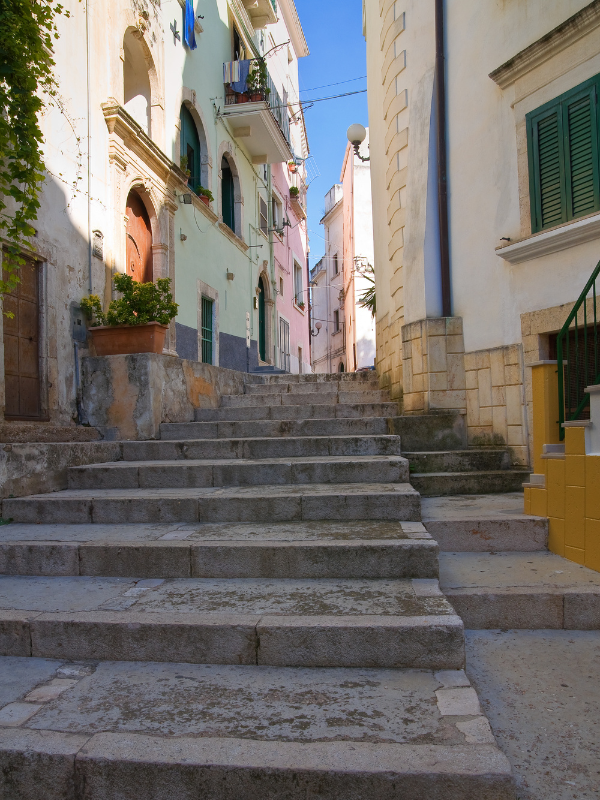 Stairs in a narrow, colorful street at Rodi