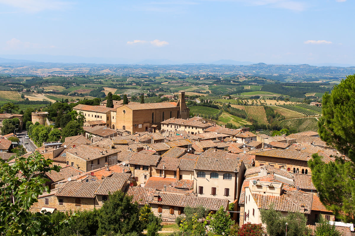 View of the buildings and vineyards in Tuscany. For your Florence itinerary, you have the option to either take a day trip around this place or to another beautiful neighborhood in Florence.