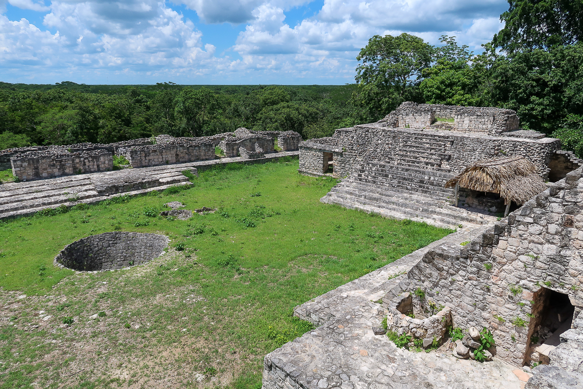 Ruins of Ek Balam surrounded by lush jungle. Visiting this site is one of the best things to do in the Yucatan Peninsula.