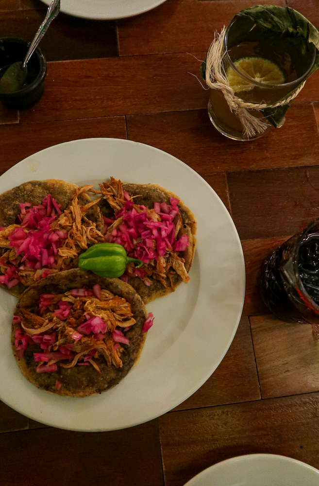 Cochinita pibil tacos served on a plate