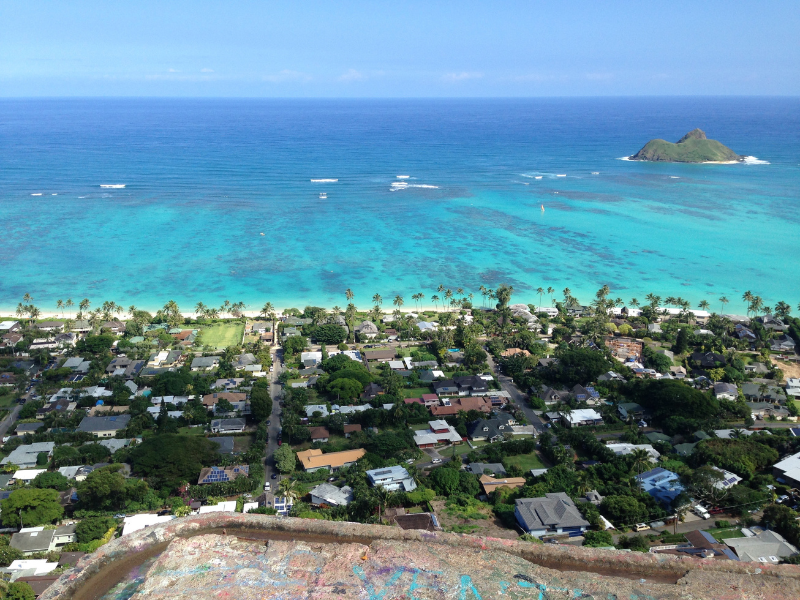 View from the peak of Lanikai Pillbox hike overlooking the beautiful village and the vast ocean. Make sure to include Lanikai Pillbox hike in your Oahu itinerary.