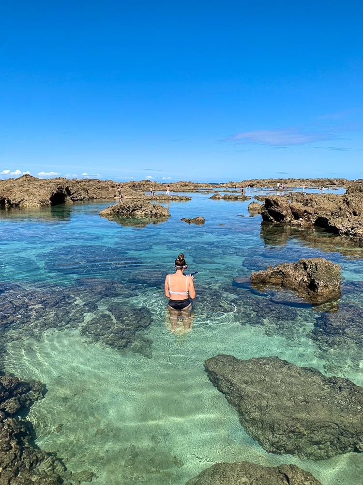 Maddy wading through the waters of Shark's Cove