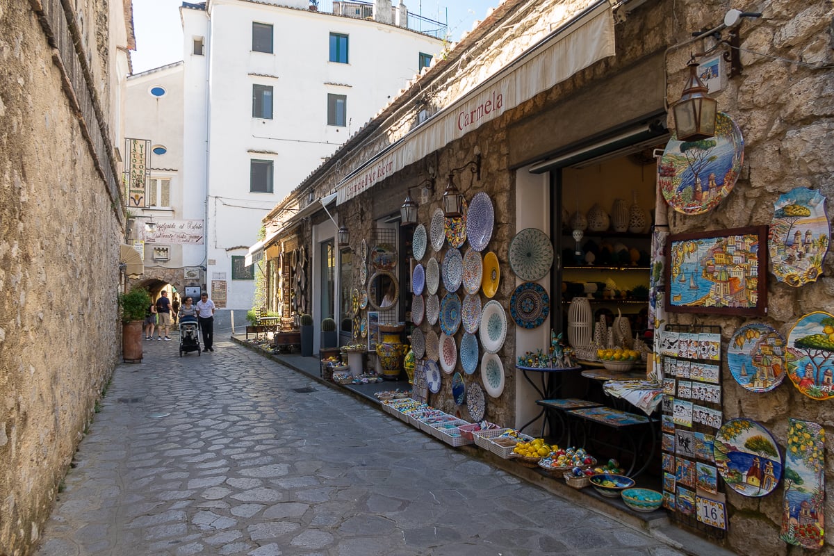 Colorful ceramics displayed outside of a souvenir shop. Shopping souvenirs is one of the best things to do in Ravello.