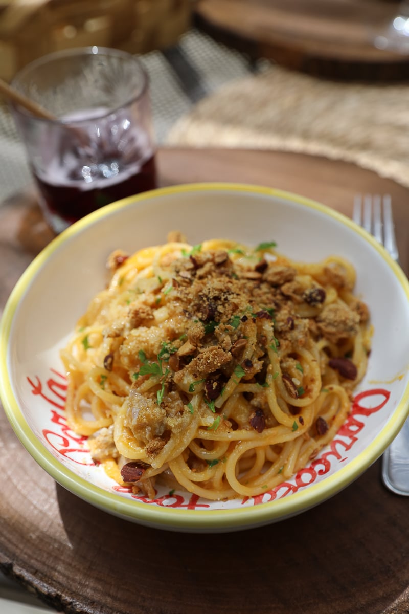 A fresh plate of pasta and a cocktail