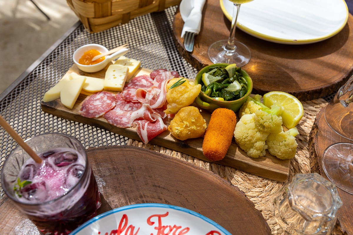 An antipasto plate in Italy with some cocktails