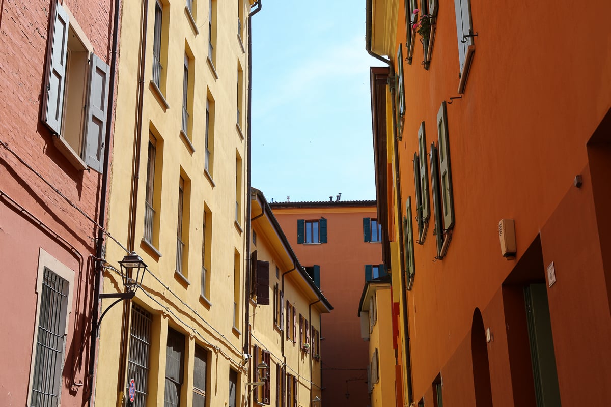 Buildings painted red, yellow, and orange in Italy