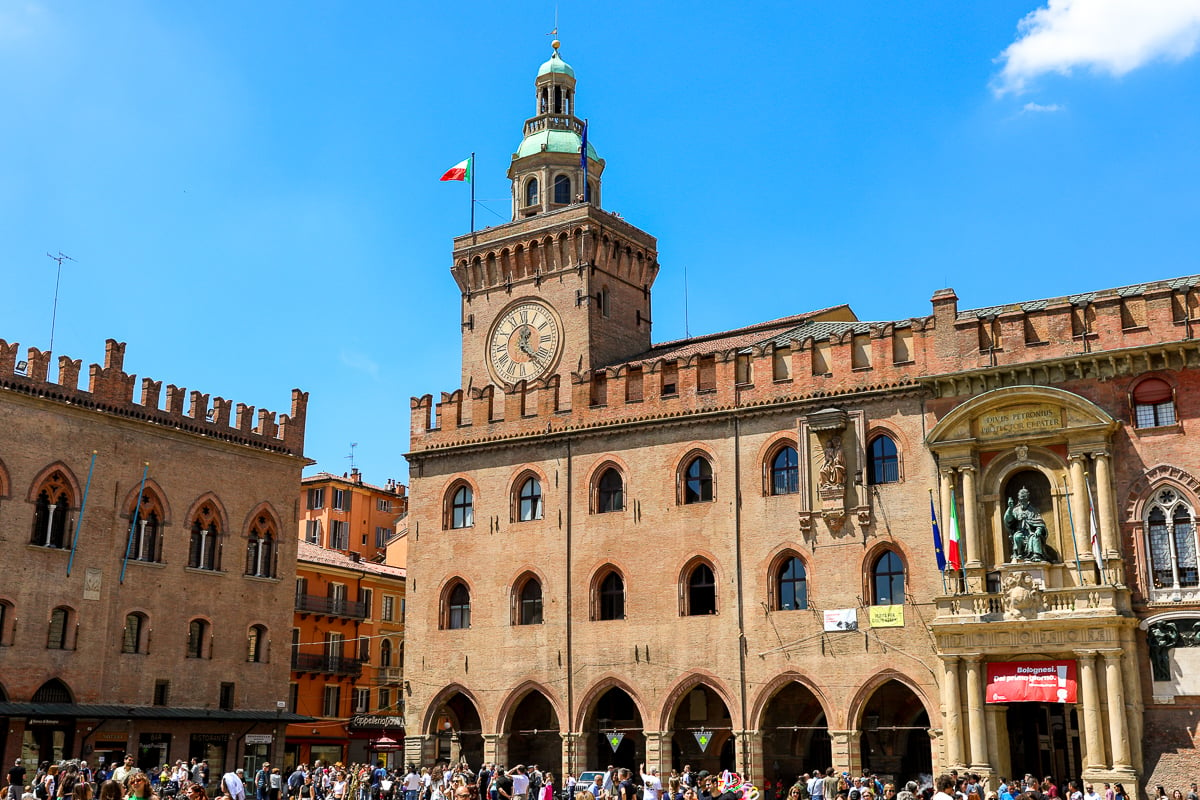 The bustling Piazza Maggiore in Bologna on a sunny day