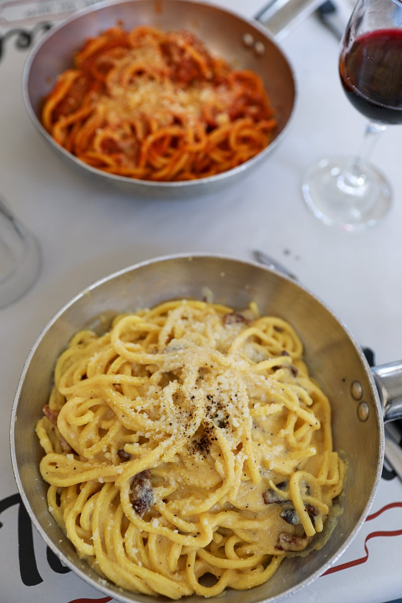 Two plates of traditional Roman pasta