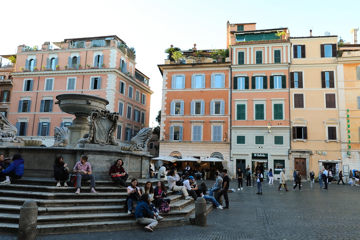 People hanging out in the main square in Trastevere, Rome