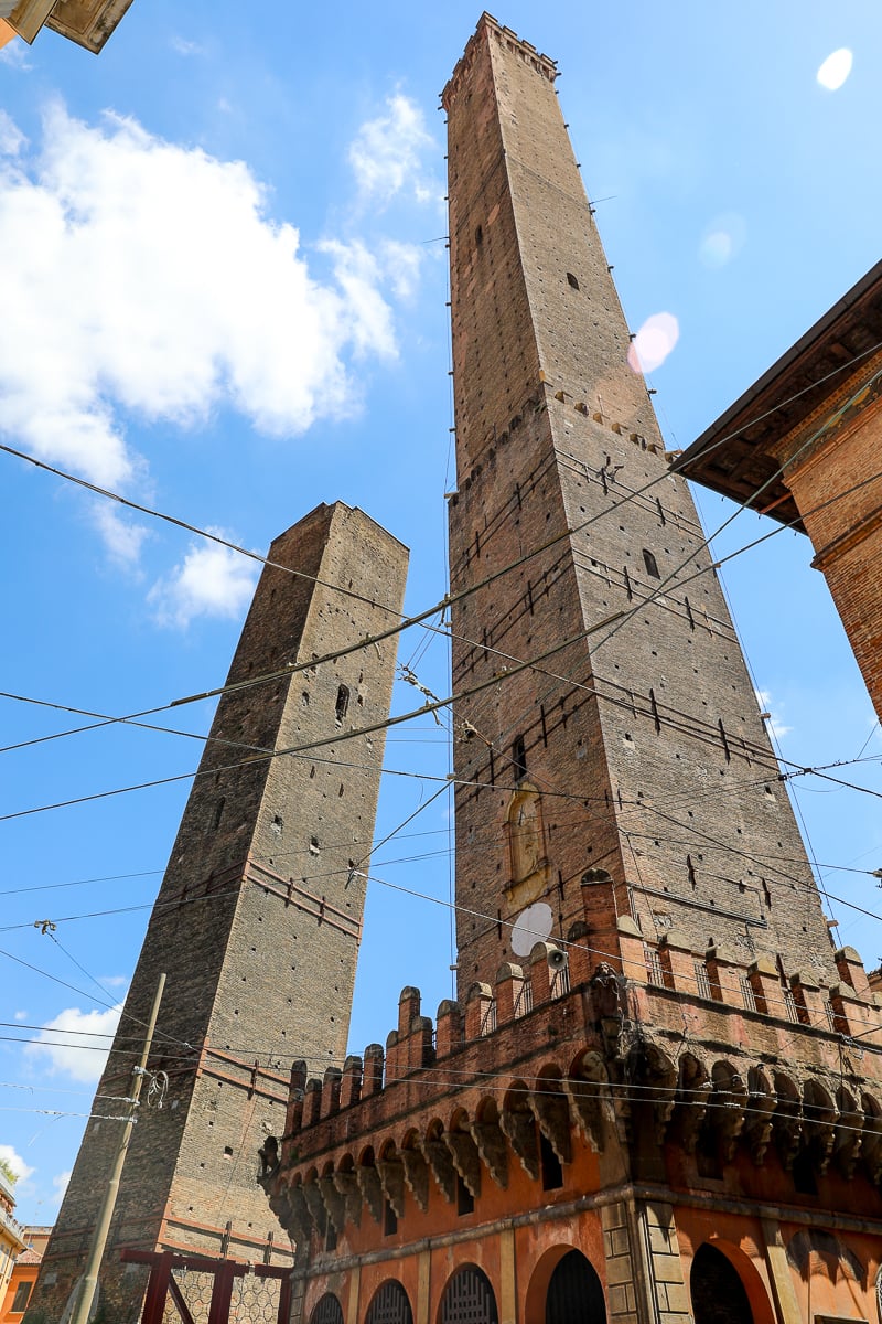 A view of the two leaning towers in Bologna on a sunny day