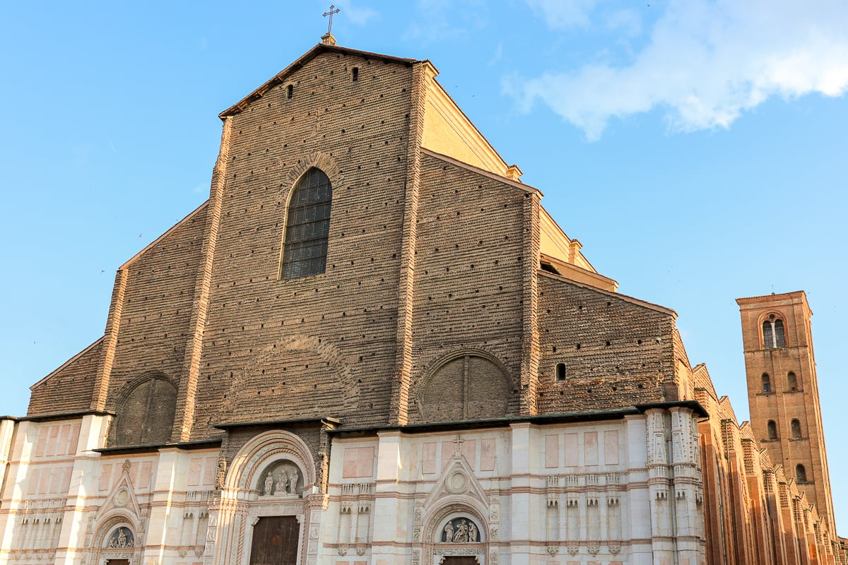 The brick and tile facade of the Basilica di San Petronio in Bologna