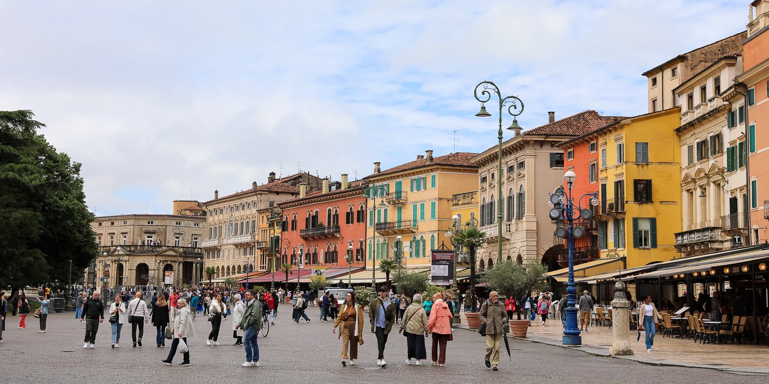 Crowd of tourists and locals roaming around Verona's city center