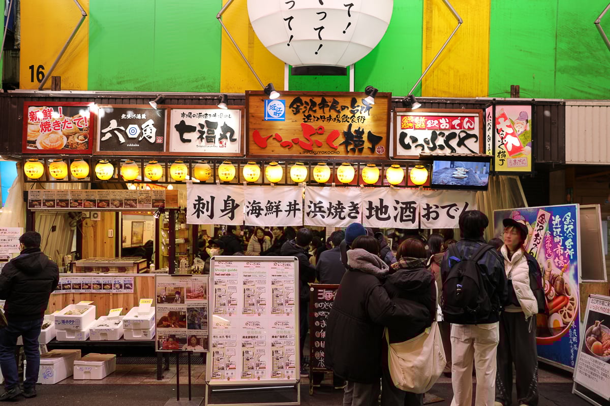 Crowd of people lining up outside an Oden shop in Kanazawa