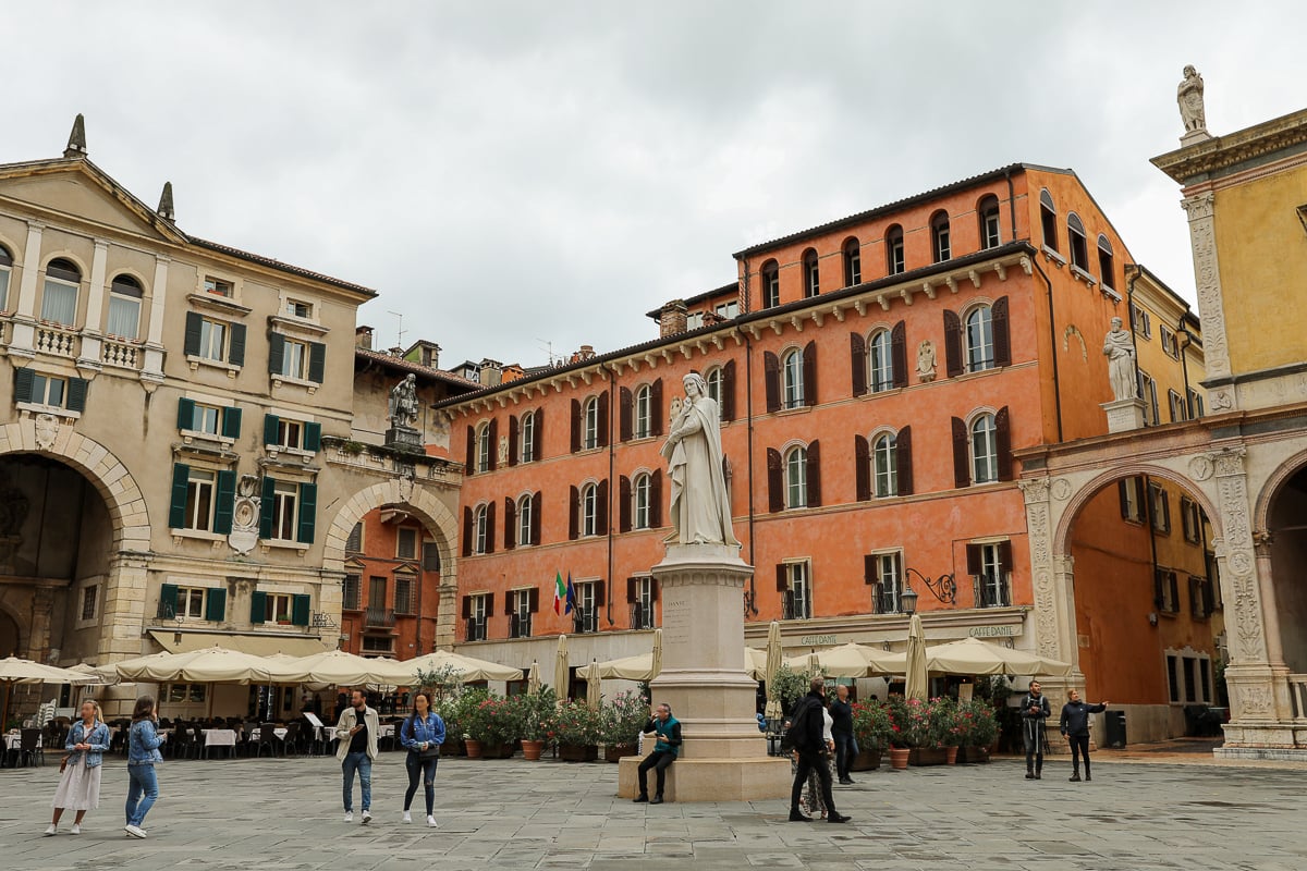 People roaming around the Dante statue in Piazza dei Signori. Looking for tips for your two days in Verona? This guide provides helpful information that you'll need.