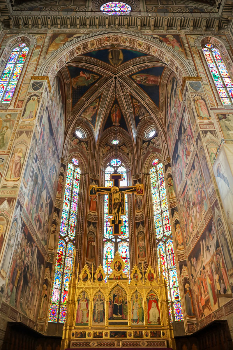 Intricate frescoes and gold details within the Basilica di Santa Croce