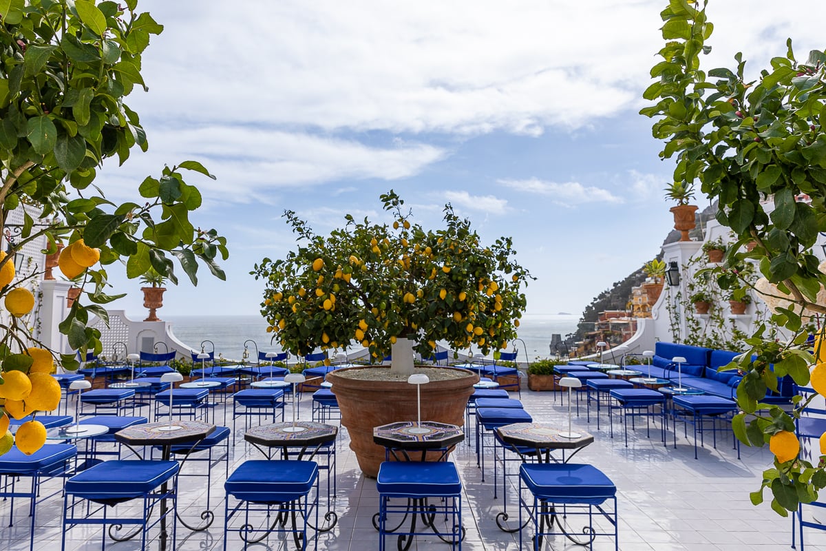 Outdoor seating at Franco's Bar overlooking the vast sea. Looking for top Positano travel tips? This guide has everything you need to know.