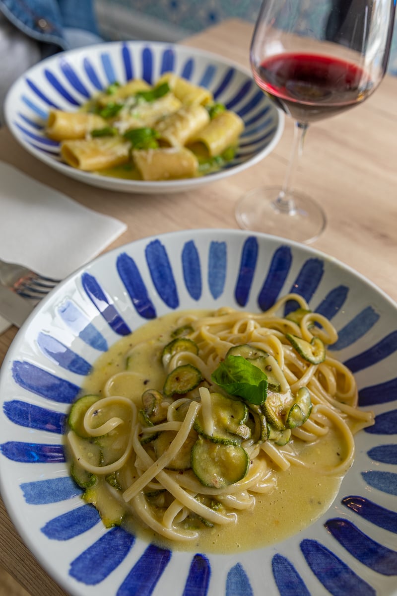 Scrumptious pasta and a glass of wine at a restaurant in Positano