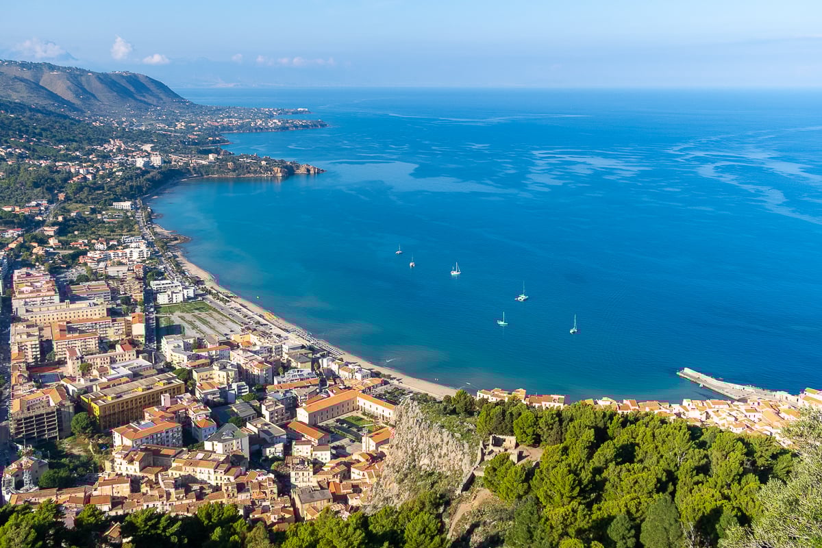 Aerial view of the beautiful village of Cefalù and the blue sea on a sunny day