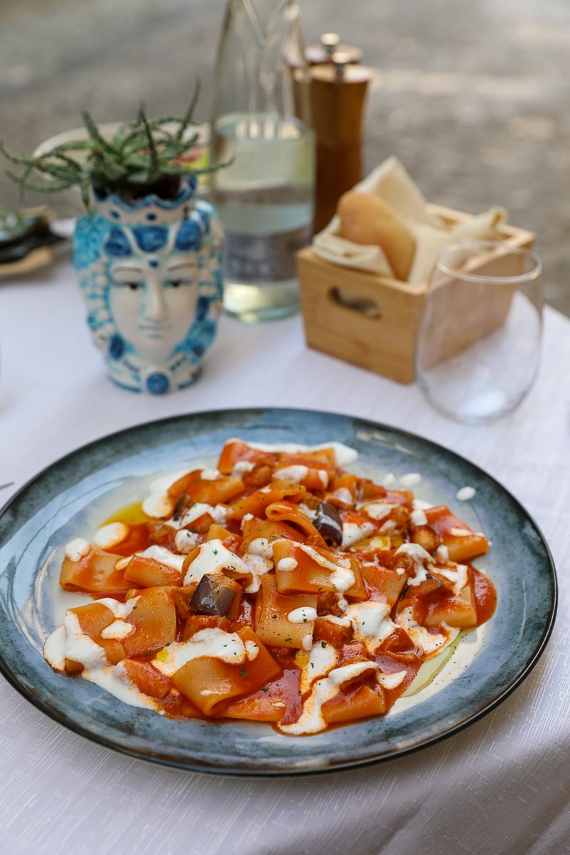 Plate of delicious pasta on a white tablecloth