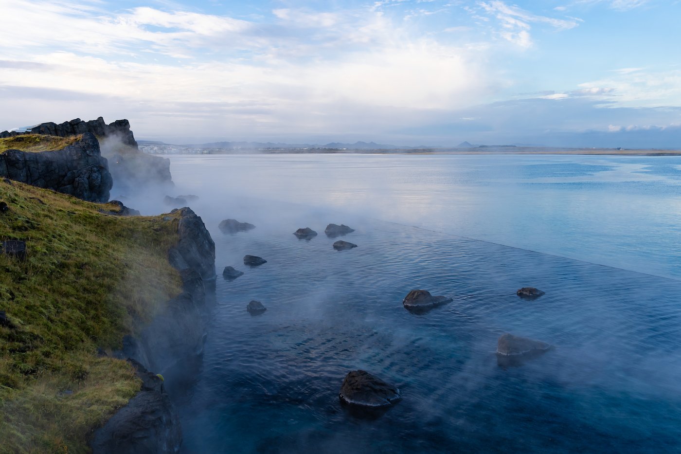 Steam coming out of the blue waters of Sky Lagoon in Reykjavík