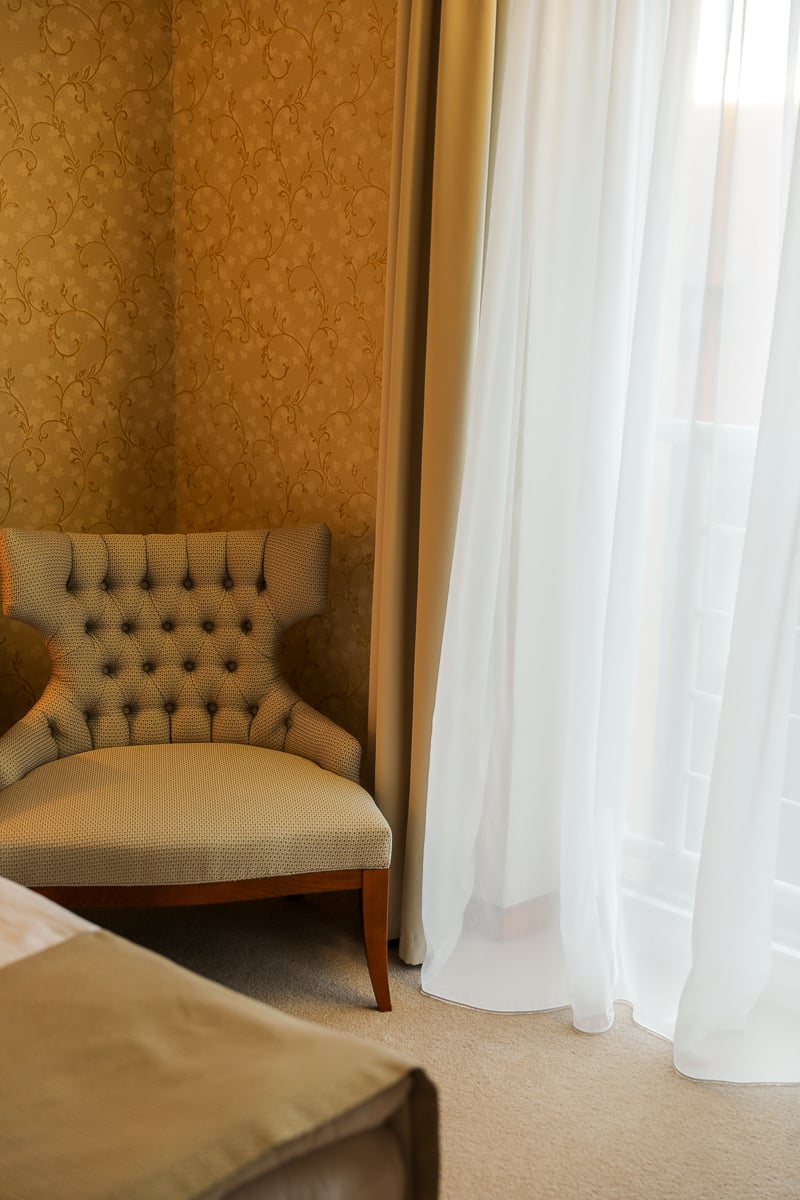 Elegant interior details and seating area inside of a guest room at Hotel Rott in Prague