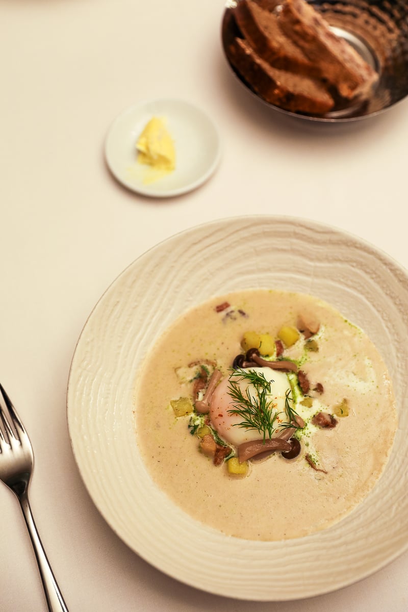 Kulajda soup with mushrooms and dill served at CODA restaurant at the Aria Hotel Prague