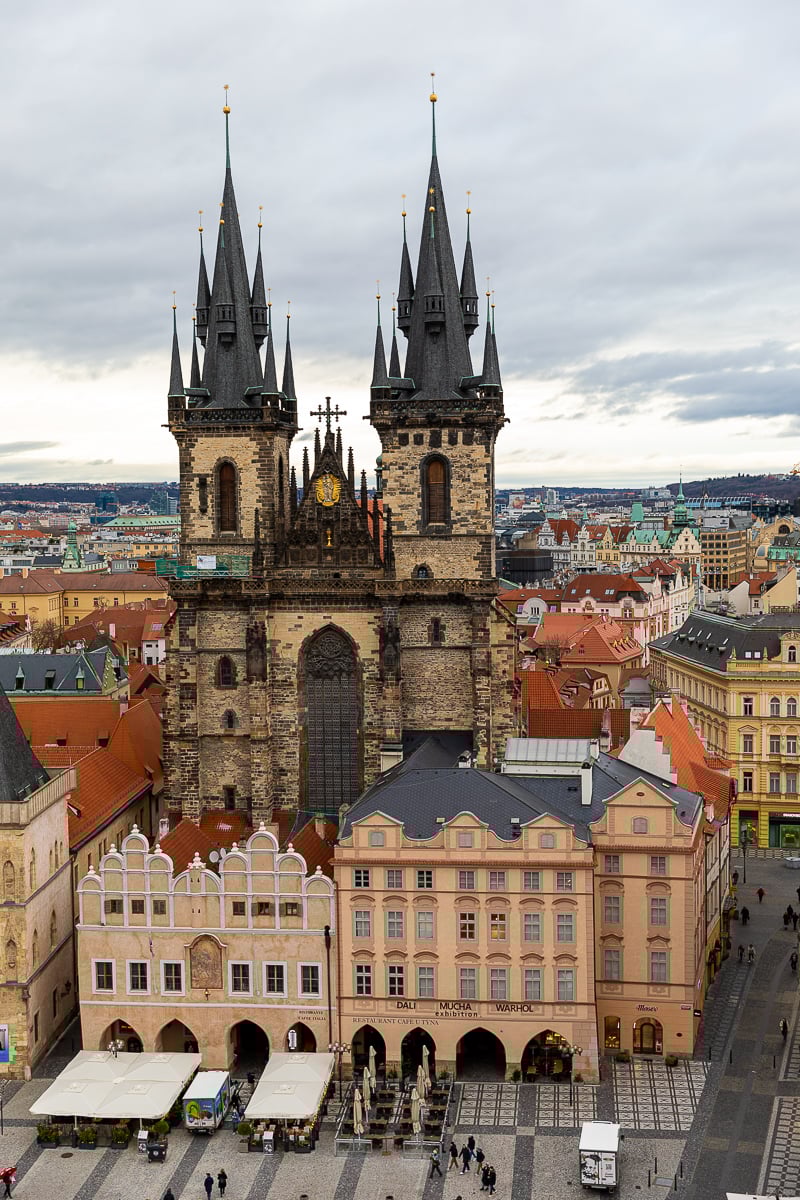 Elevated view of the Church of Our Lady before Týn rising above Prague’s Old Town rooftops and arcaded buildings