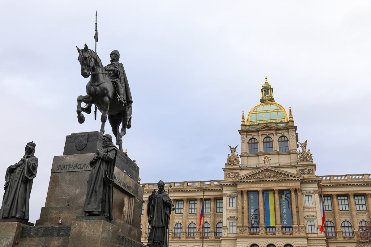 Wenceslas Square in Prague’s New Town with historic buildings, tram lines, and the National Museum in the background