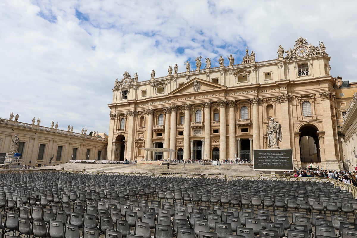 St. Peter’s Basilica façade overlooking rows of chairs set up in St. Peter’s Square for a papal audience
