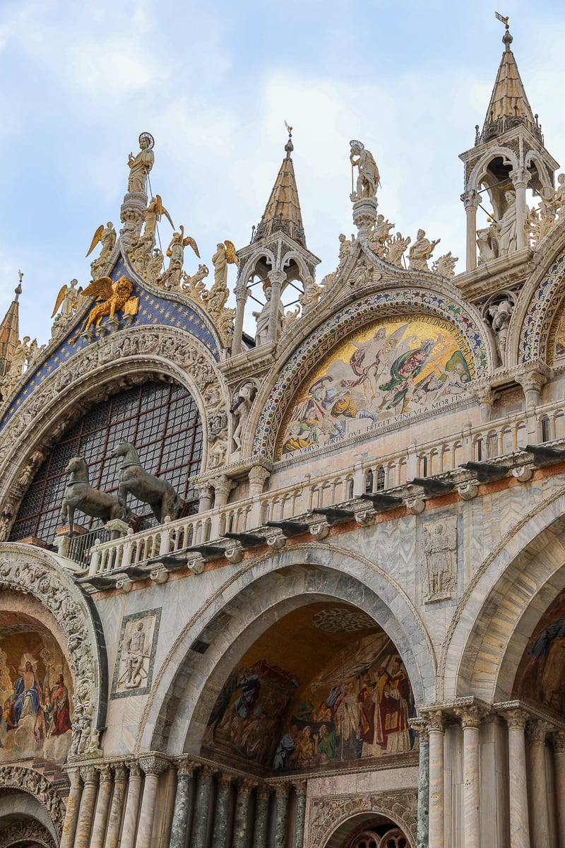 Close-up of St. Mark’s Basilica façade – arches, mosaics, and statues in Venice