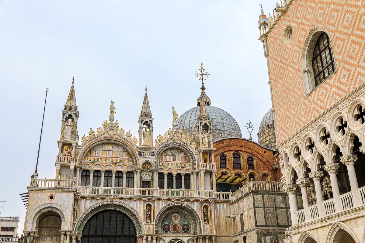St. Mark’s Basilica domes and Doge’s Palace arches in St. Mark’s Square, Venice