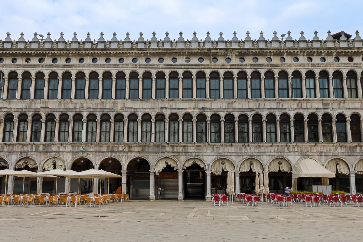 St. Mark’s Square in the morning – quiet Piazza San Marco with arcades and café tables set up
