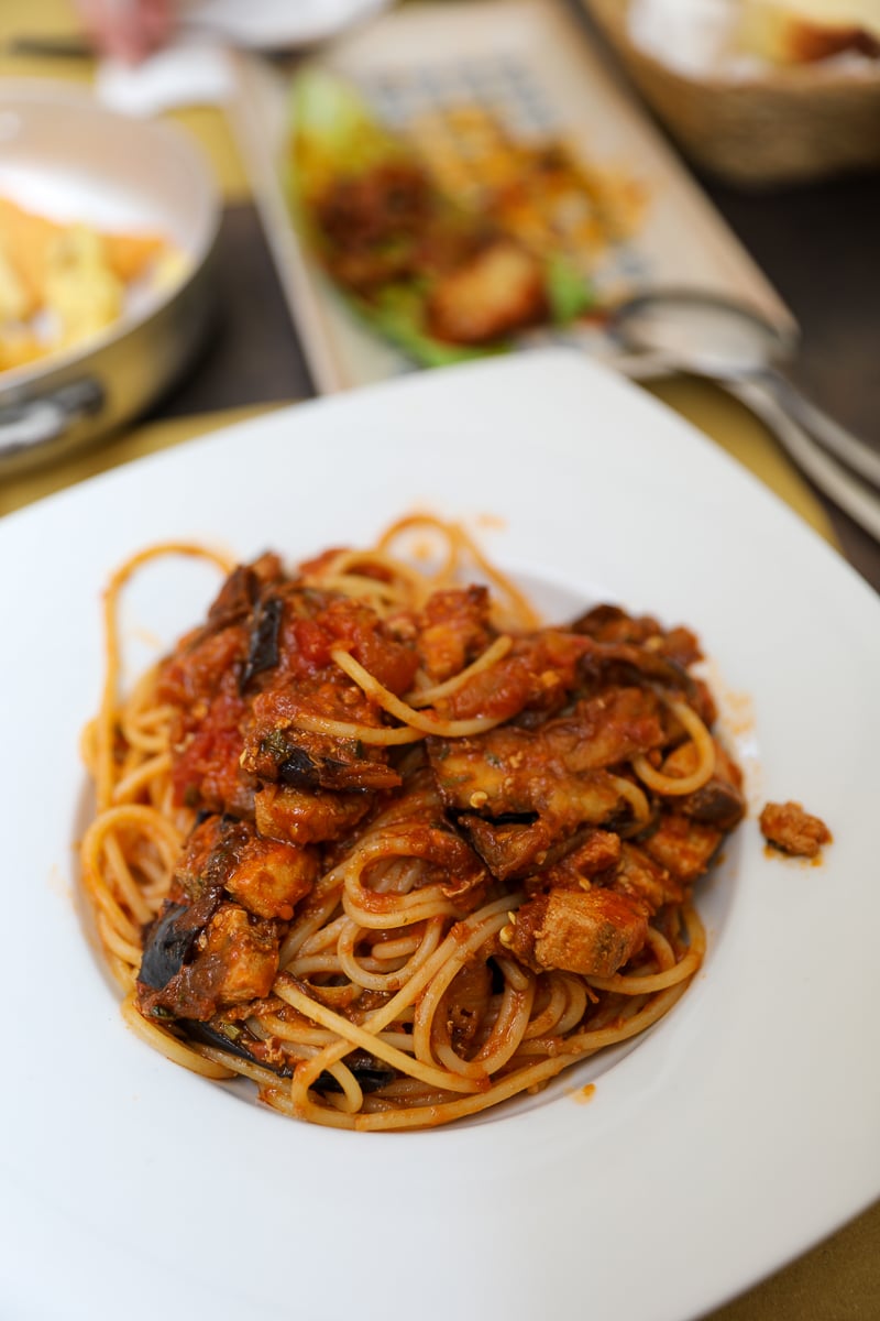 Plate of Sicilian swordfish pasta in tomato sauce at a restaurant in Palermo, Sicily